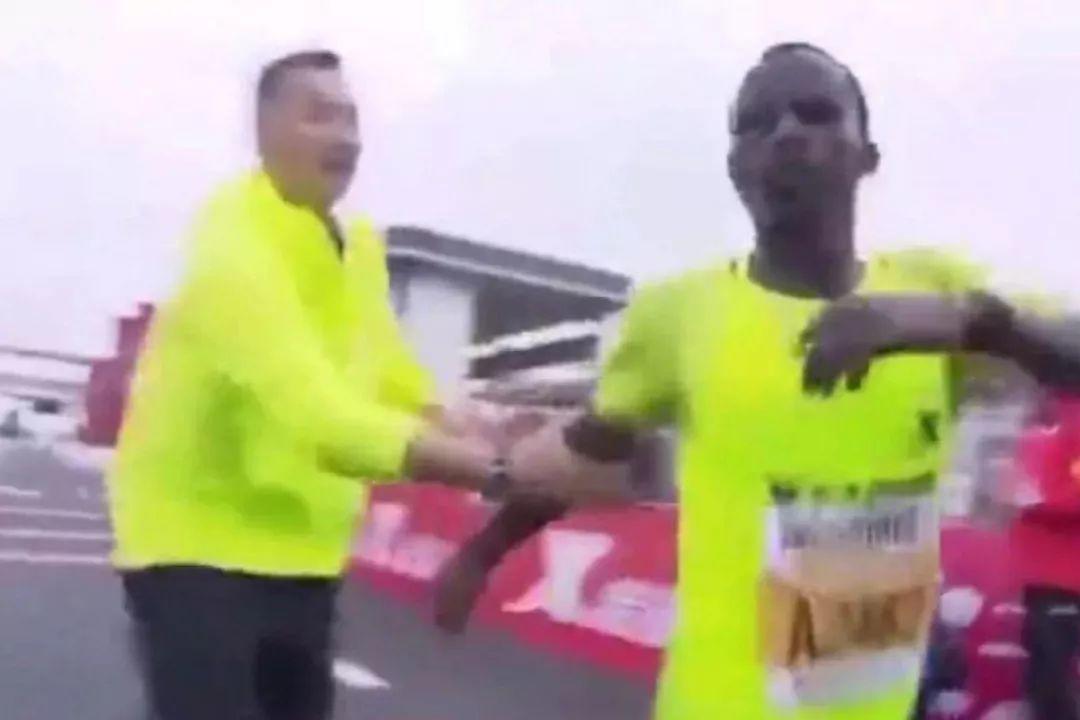 ethiopian forced to a stop at finish line! marathon drama!
